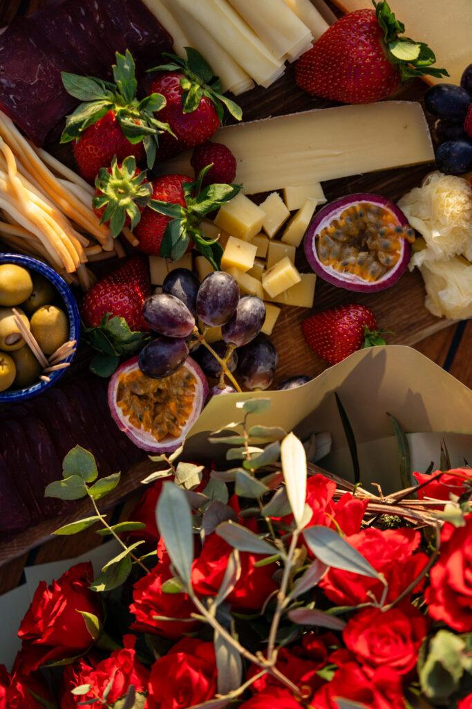 Romantic boat picnic with roses, passion fruit and proposal chocolate