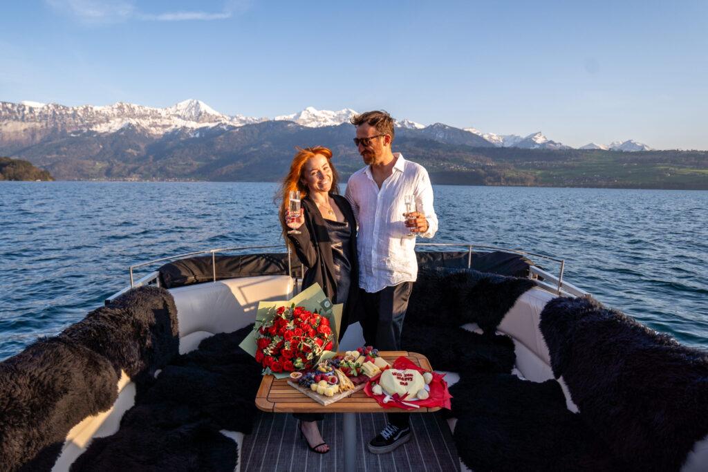 Private boat proposal cruise with engagement setup and alpine views